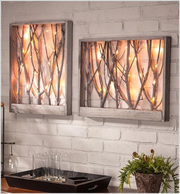 Lamps Created from String Lights Covered Tree Branches Inside a Wood Frame