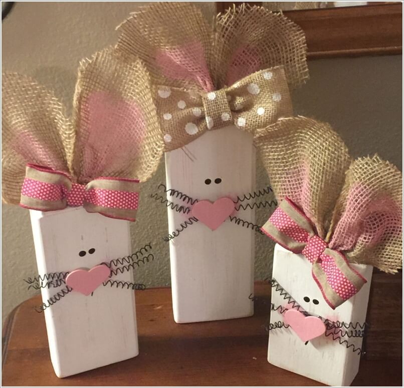 Paint Wood Slabs in White Color and Turn Them into Bunnies with Felt Hearts, Springs and Burlap Ribbons